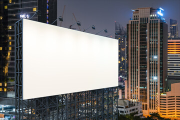 Obraz premium Blank white road billboard with Bangkok cityscape background at night time. Street advertising poster, mock up, 3D rendering. Side view. The concept of marketing communication to sell idea.