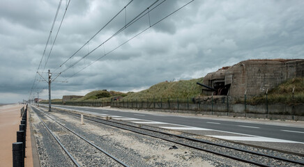 Tram line in front of the Atlantic Wall defences in Raversyde open air museum, located in Oostende, Belgium