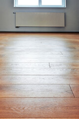 Interior laminated wooden floor in close-up