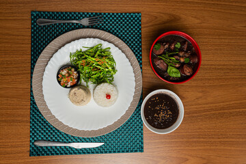 traditional Brazilian feijoada with orange juice