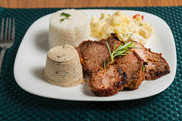 steak with rice and mayonnaise salad