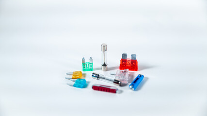 Set of transparent, multicolored fuses on a white background