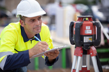 the surveyor makes measurements for the cadastre