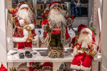 Close up of different red Santa Claus figures christmas decoration puppets