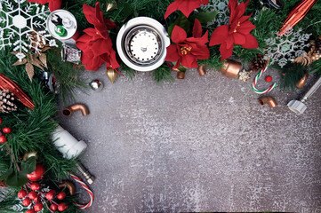 Construction and plumber tools on Christmas background. Plumbing supply over holiday decoration...