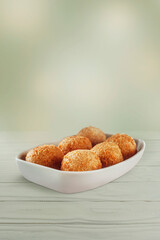 Brazilian snack deep fried cheese croquettte isolated - Bolinha de queijo