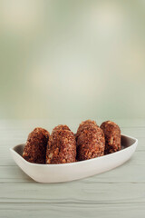 Brazilian snack kibbeh (Middle Eastern minced meat and bulghur fried snack) isolated - Kibe de carne