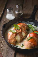 Chicken fillet baked with mozzarella tomatoes and basil