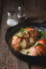 Chicken fillet baked with mozzarella tomatoes and basil