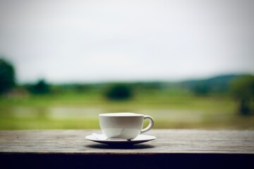 cup of coffee on wooden table