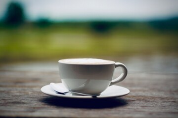 cup of coffee on a wooden table