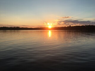 Naklejka premium sunset over the river