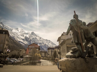 Sculpture in the main square of Chamonix of two mountaineers point to Mont Blanc