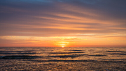 Fototapeta na wymiar Beautiful sunrise over the Sea