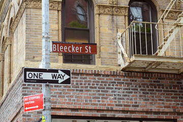 Street sign for Bleecker Street on the corner with Grove Street in New York City