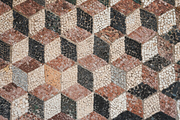 Fragment of antique cubic mosaic pattern tile in old city of Bar, Montenegro.