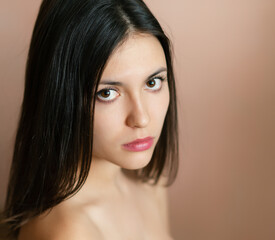 Portrait of a beautiful young brunette. Selective soft focus.