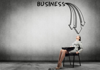 Obraz premium Emotional businesswoman in chair