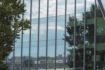 Reflections in the Windows of the modern glass building of the business center