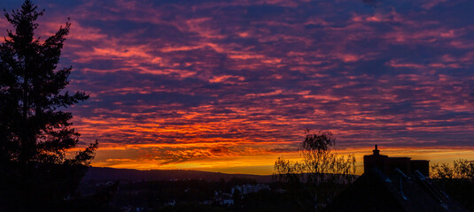 Sunrise Panorama with the magical sky, purple to red clouds with the golden horizon near Koblenz, Germany