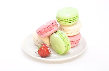colorful macaroons on a white plate