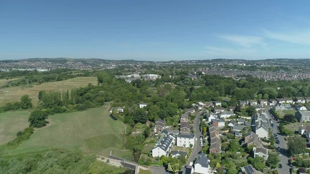 A mixture of suburban estates and open green landscape on the river exe, Riverside country park. Devon