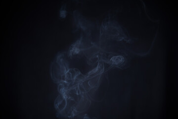 Smoke in motion on dark background	