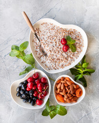 Oatmeal muesli with berries and yogurt on a light background. The concept of a healthy Breakfast.