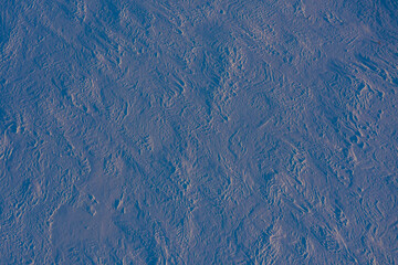 Drone shot. Frozen snow field texture