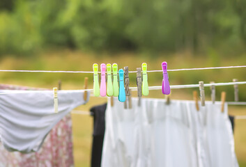 Colorful laundry hanging on the rope outdoors