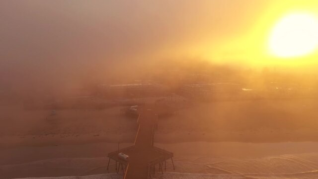California 2020 wildfire season Pismo Beach Pier eerie sunrise. Drone over pier