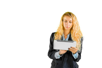 Blonde businesswoman using a tablet on studio