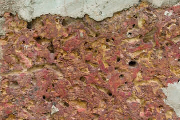 Old brick wall, old texture of red stone blocks closeup