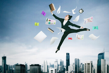 Businesswoman reads book while jump with documents