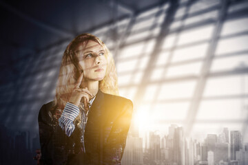 Fototapeta premium Double exposure of pensive blonde businesswoman