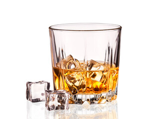 Crystal glass of whiskey with ice cubes isolated on white.