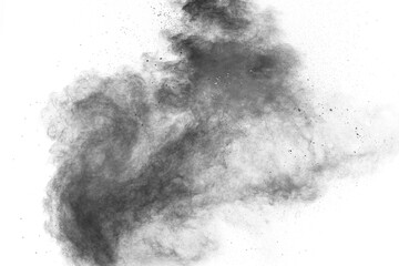 Black particles splatter on white background. Black powder dust exploding.