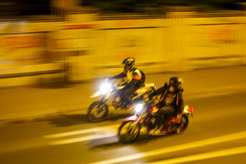 bikers racing at night