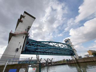 Steel bridge and double water barrier in the river Hollandsche IJssel