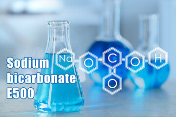Text Sodium bicarbonate E500 with soda formula and laboratory glassware on background