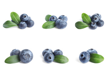 Set of fresh blueberries with green leaves on white background