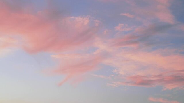 Beautiful pink clouds during sunset, blue sky with clouds background.