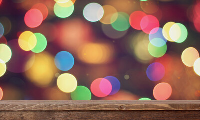 wooden table on a blurry holiday background with bokeh.