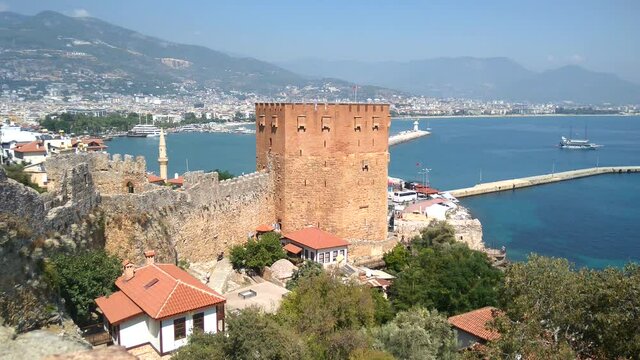 Alania.Turkey.September 4, 2020.View of the walls of the ancient fortress and the tower of Kyzyl Kule in Alanya in Turkey at sunset
