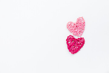 Two little wooden heart on white background, love and romance symbol, valentine concept background