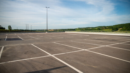 Close-up of a large open-air parking lot, empty