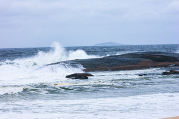 waves crashing on rocks