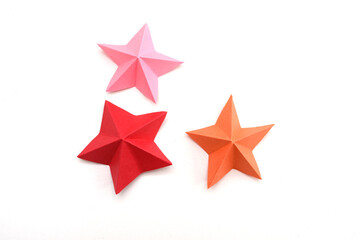 Obraz premium Christmas origami stars on white
