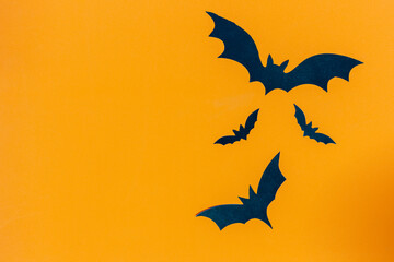 Halloween background ,bat with copy space on orange background