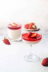 Italian panna cotta dessert with strawberry sirup and mint leaf